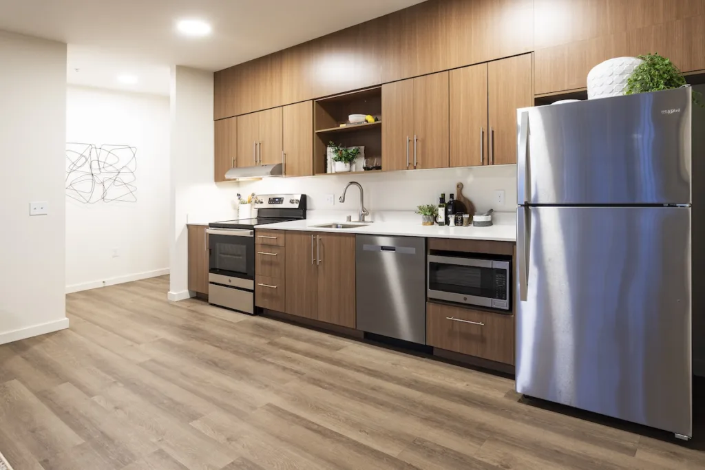 Kitchen with stainless steel appliances of the 1 bed 1 bath floor plan.