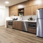 Kitchen with stainless steel appliances of the 1 bed 1 bath floor plan.