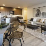 Open concept living room and kitchen of the 3 bed 2 bath floor plan